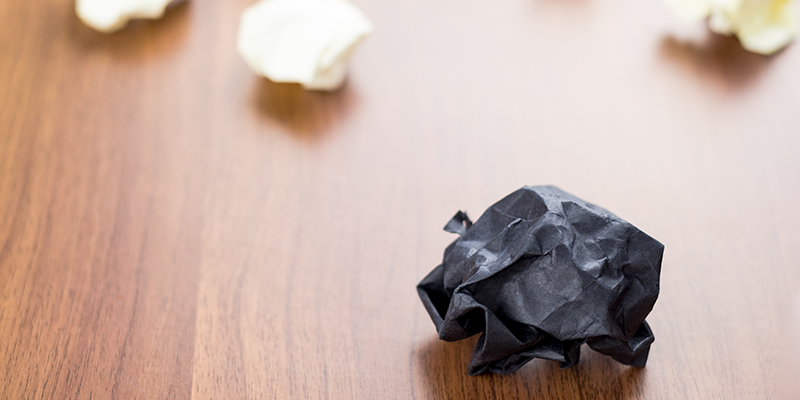 black-paper-ball-on-table-representing-bounce-back-loan-write-offs