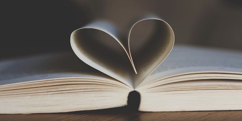 book with page folded into heart shape
