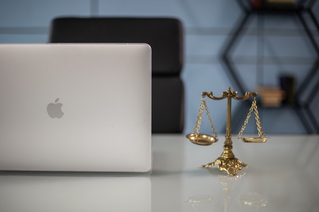 laptop with scales of justice feature