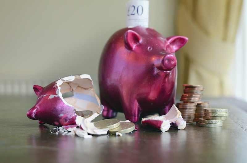 smashed-and-whole-piggy-bank-with-cash-inside-insolvency-creditors-meeting