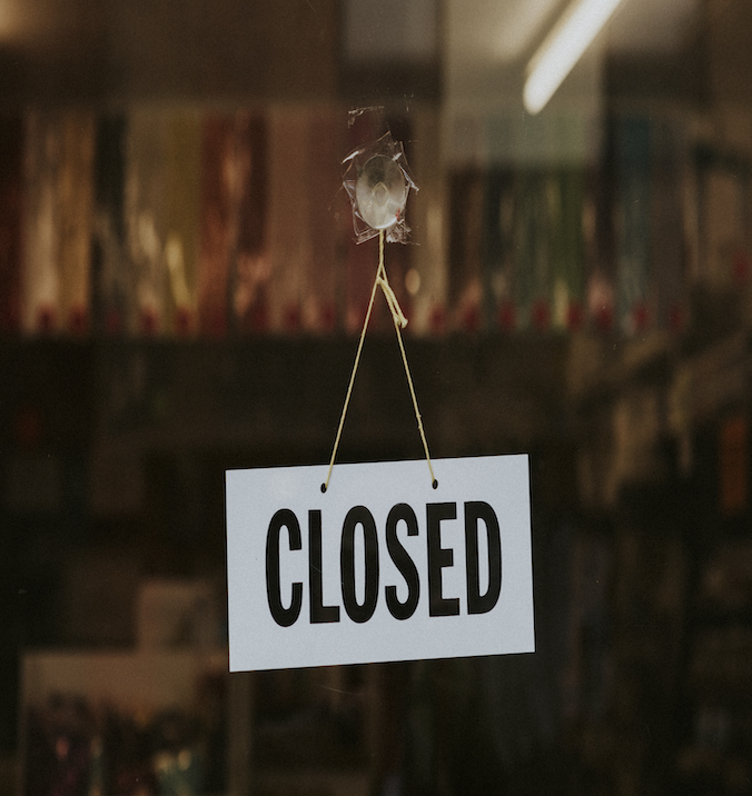 business-closed-sign-in-window