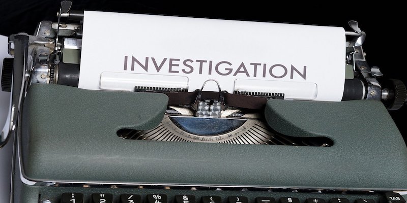 the word investigation written on typewriter