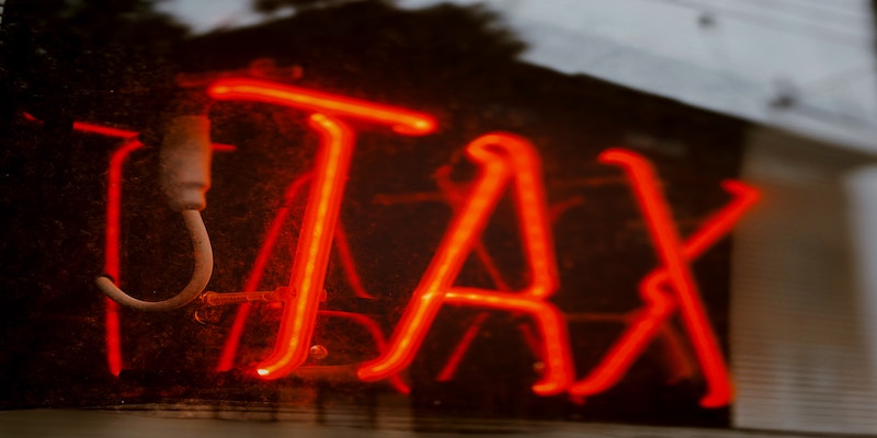 the word tax in neon lights