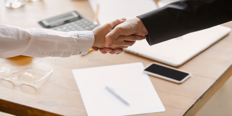 two-people-shaking-hands-creditor-agreement.
