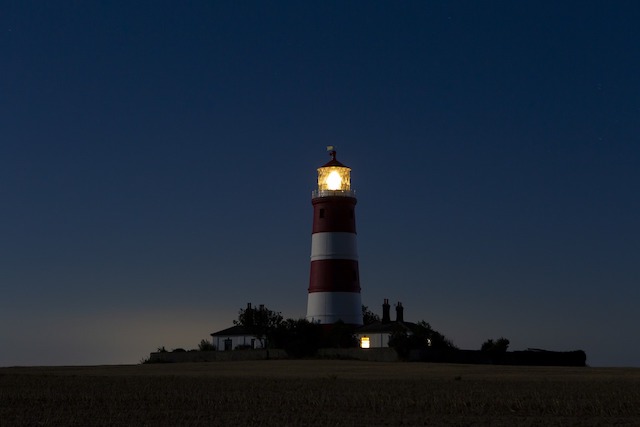unlawful-dividend-consequences-represented-by-lit-lighthouse-in-night